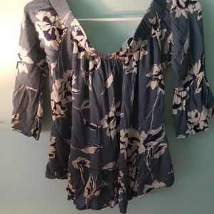 Floral patterned cold shoulder blouse.